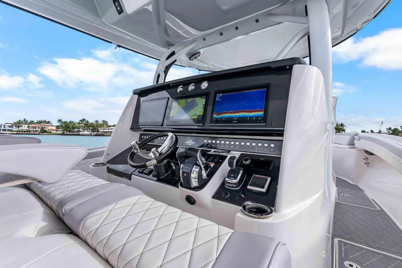 Slide: The Image of 2021 Fountain 43 NX boat dashboard with advanced navigation and control systems. - 48