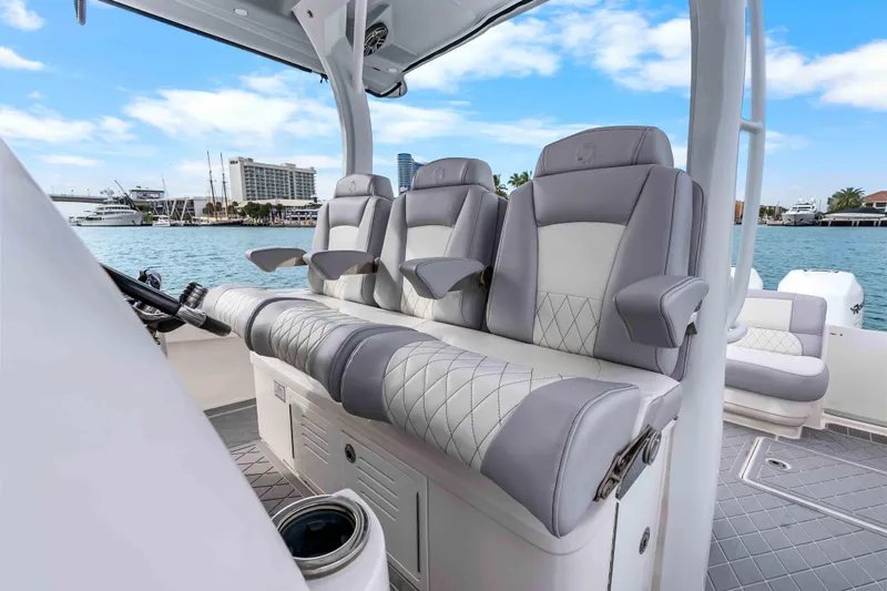 Slide: The Image of 2021 Fountain 43 NX boat interior with luxurious seating and waterfront view. - 49