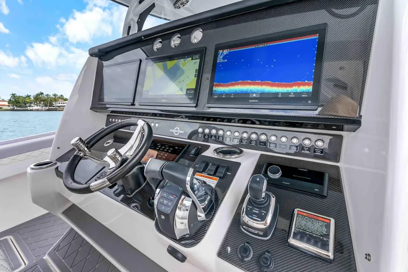 Slide: The Image of 2021 Fountain 43 NX boat dashboard with advanced navigation and control systems. - 51