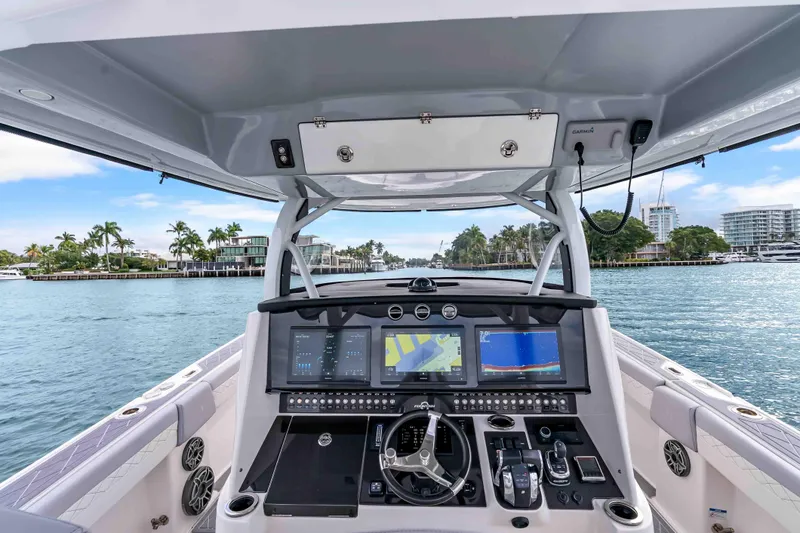 Slide: The Image of Cockpit view of 2021 Fountain 43 NX boat with advanced navigation system. - 53