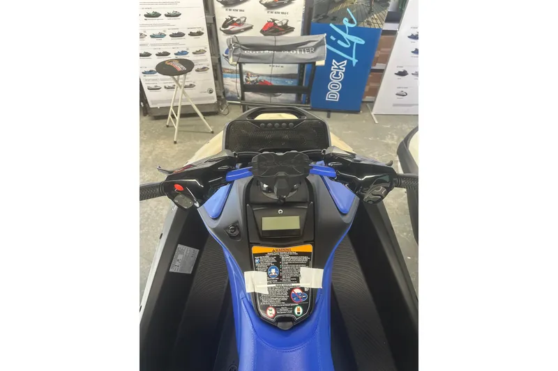 Slide: The Image of 2025 Sea-Doo Spark Trixx for 3, cockpit view, showcasing handlebars and controls. - 6