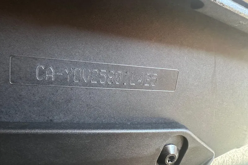 Slide: The Image of 2025 Sea-Doo Spark Trixx hull identification number (HIN) on black surface. - 9