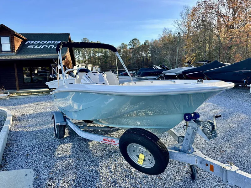 Slide: The Image of 2025 Boston Whaler 160 Super Sport on trailer in front of a building. - 5