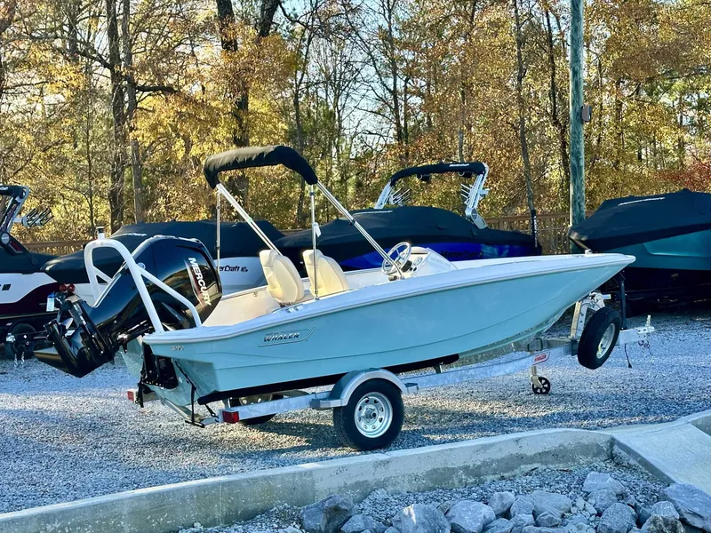 Slide: The Image of 2025 Boston Whaler 160 Super Sport on trailer outdoors. - 8