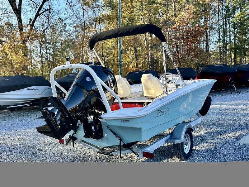 Slide: The Image of 2025 Boston Whaler 160 Super Sport boat on trailer outdoors. - 9