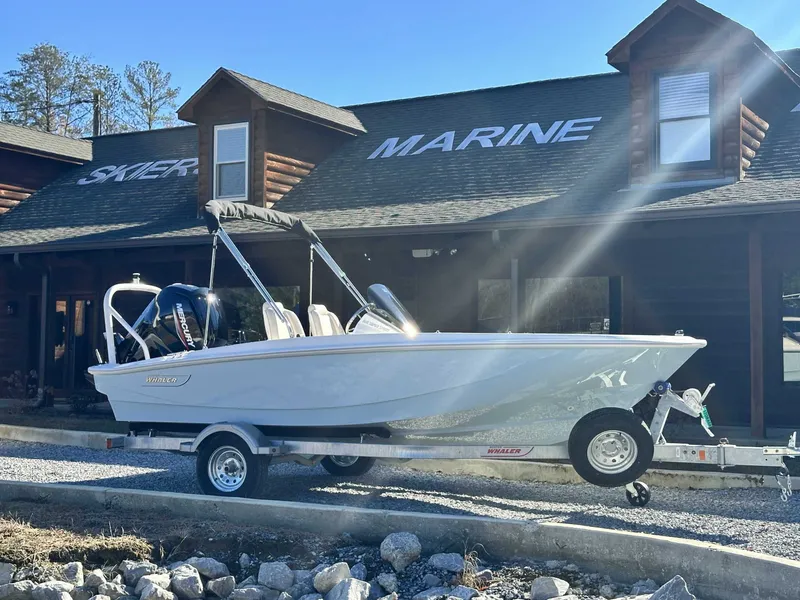 Slide: The Image of 2025 Boston Whaler 160 Super Sport in front of a marine store. - 10