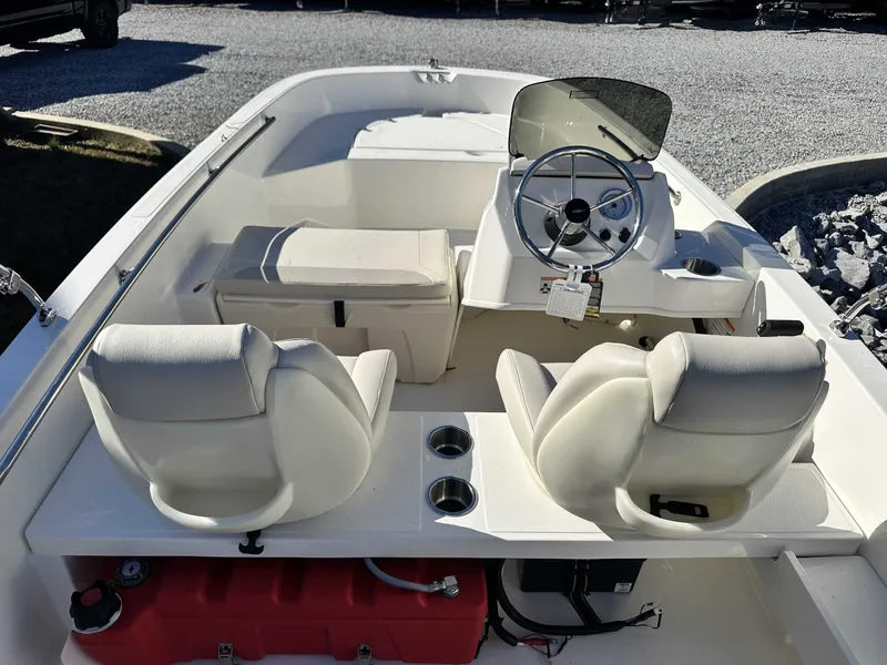 Slide: The Image of Interior of 2025 Boston Whaler 160 Super Sport with steering wheel and seats. - 13