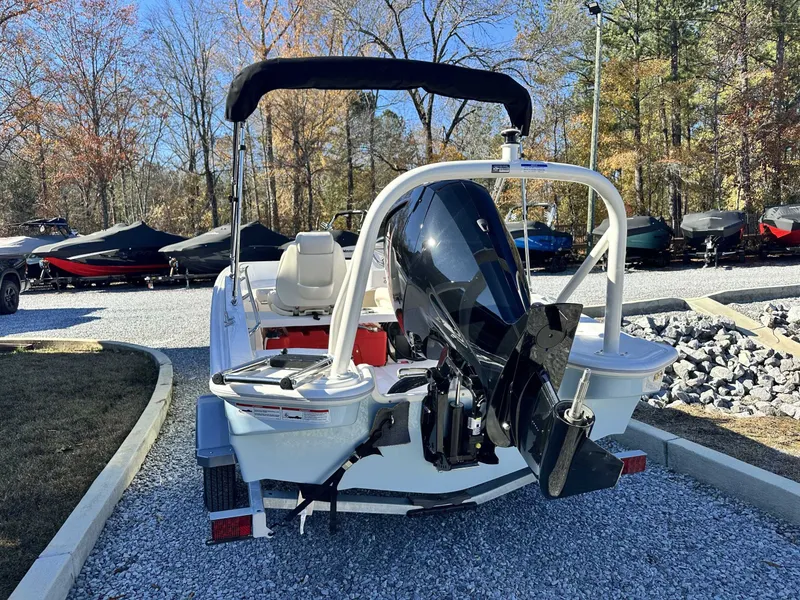 Slide: The Image of Rear view of a 2025 Boston Whaler 160 Super Sport boat outdoors. - 6