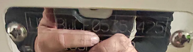 Slide: The Image of Close-up of Boston Whaler 160 Super Sport 2025 serial number. - 11