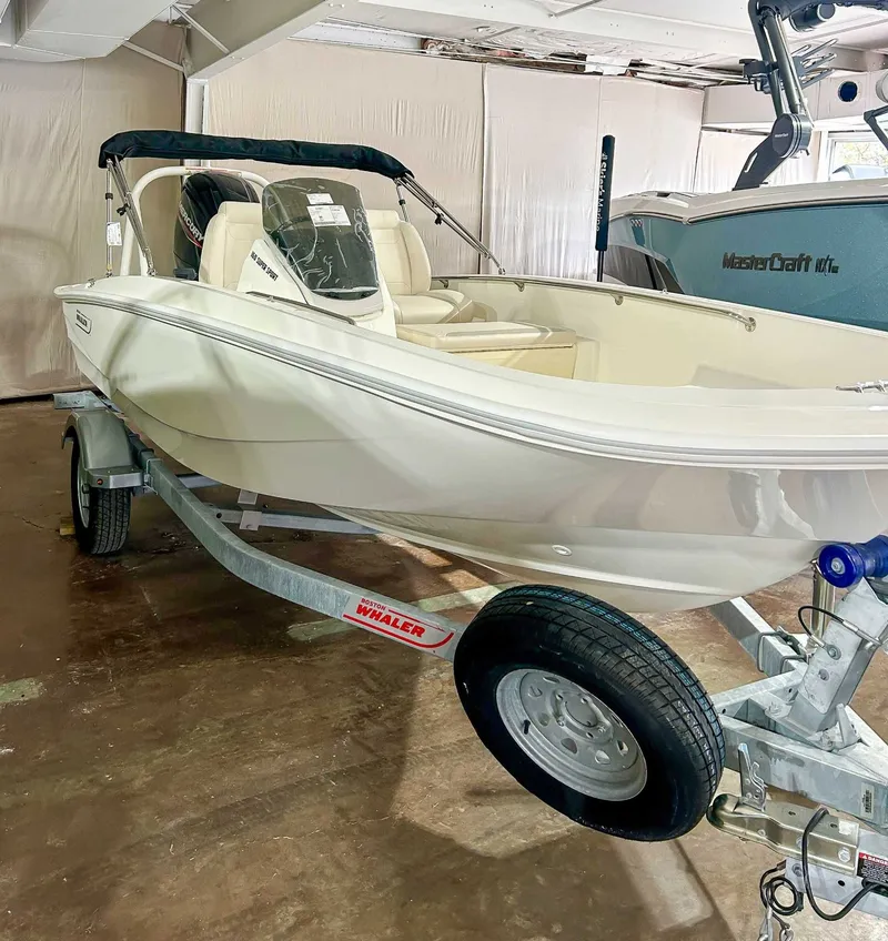 Slide: The Image of 2025 Boston Whaler 160 Super Sport on trailer in a garage. - 3
