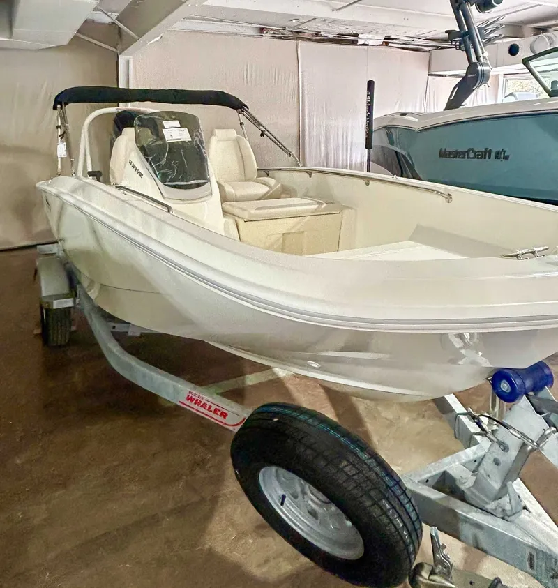 Slide: The Image of 2025 Boston Whaler 160 Super Sport on trailer in garage. - 6