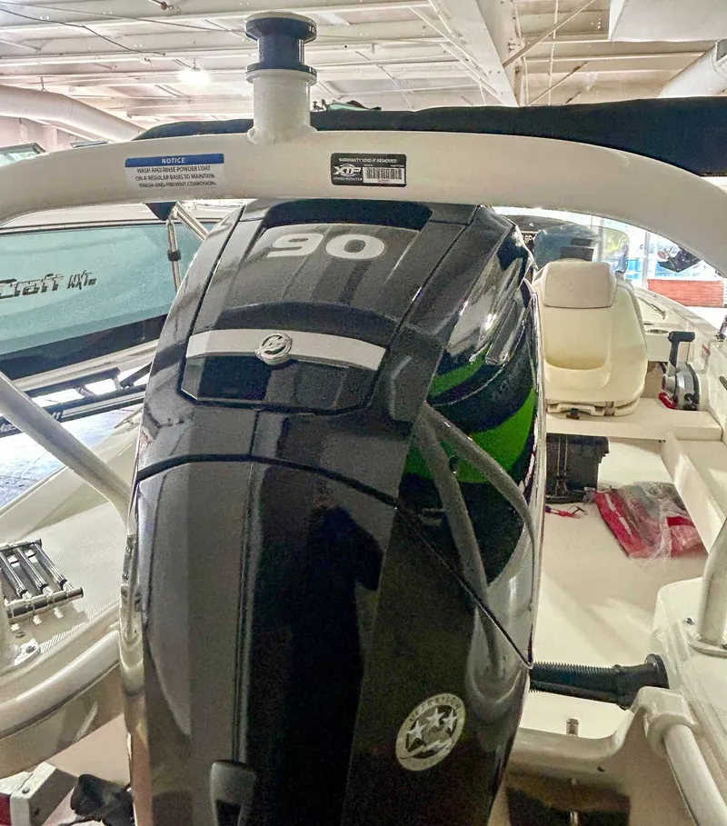 Slide: The Image of Boston Whaler 160 Super Sport 2025 with 90 HP engine indoors. - 9