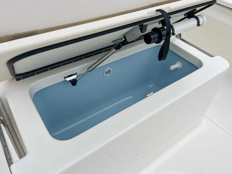 Slide: The Image of Boston Whaler 190 Montauk 2025, open storage compartment. - 20