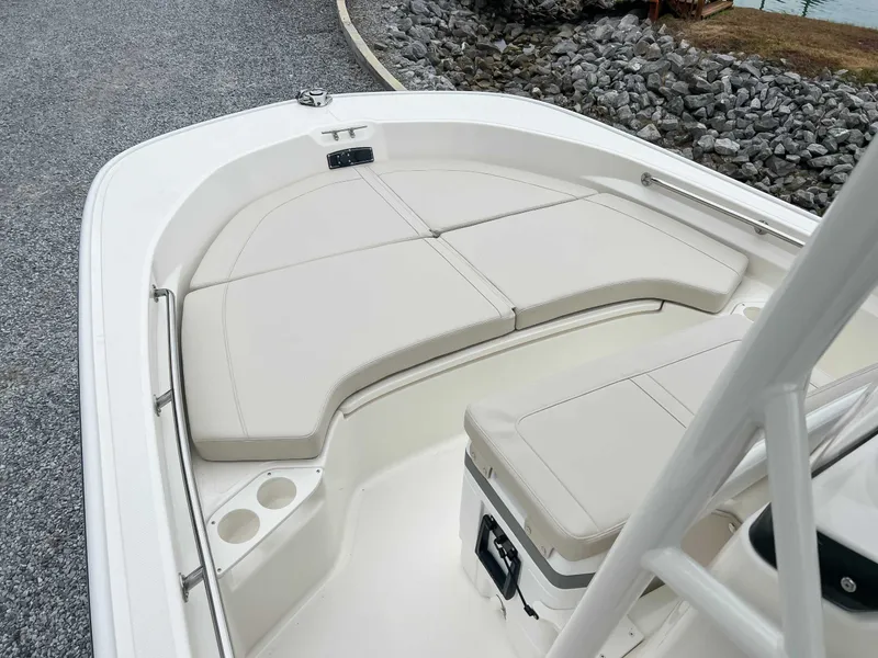 Slide: The Image of Boston Whaler 190 Montauk 2025, comfortable bow area with cushions. - 6