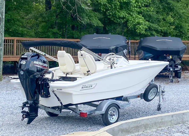 Slide: The Image of 2025 Boston Whaler 130 Super Sport on trailer outdoors. - 3