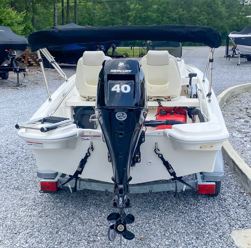 Slide: The Image of Rear view of 2025 Boston Whaler 130 Super Sport with Mercury 40 engine. - 4