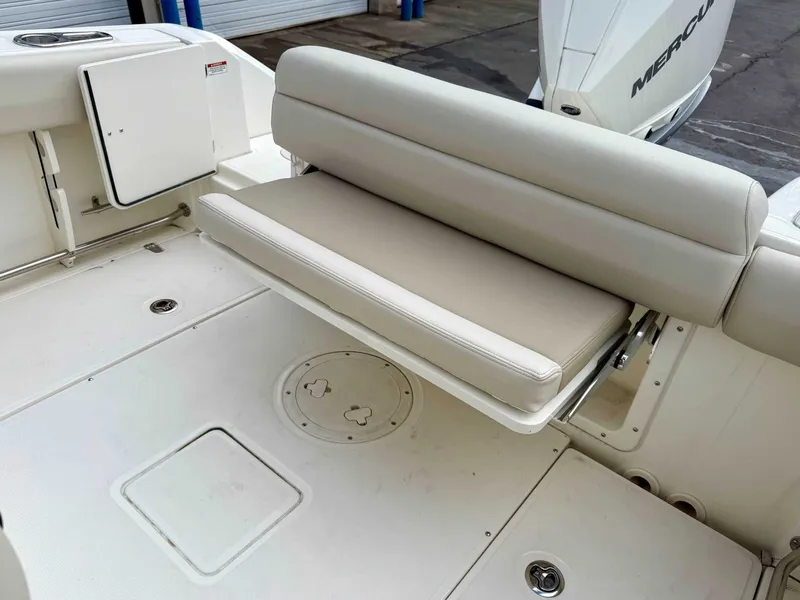 Slide: The Image of Boston Whaler 230 Outrage 2025, foldable seat in boat. - 12