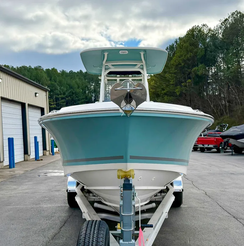 Slide: The Image of 2025 Boston Whaler 230 Outrage on trailer, front view. - 4
