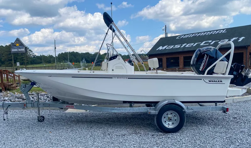 The Image of 2025 Boston Whaler 170 Montauk on trailer, parked in front of store. - 1