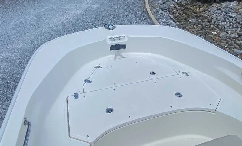 Slide: The Image of Boston Whaler 170 Montauk 2025 bow view on gravel path. - 11