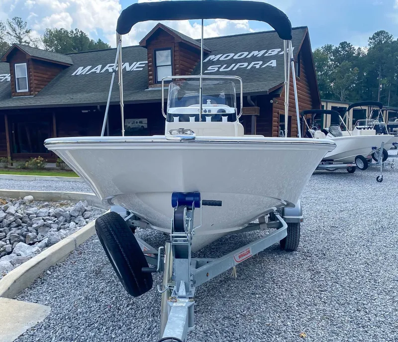 Slide: The Image of 2025 Boston Whaler 170 Montauk on trailer in front of building. - 4