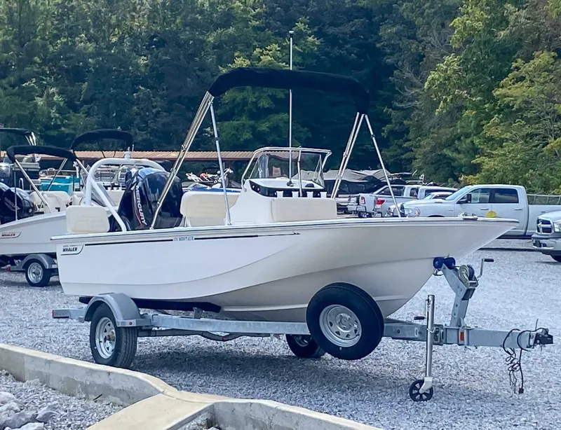 Slide: The Image of 2025 Boston Whaler 170 Montauk on trailer parked outdoors. - 5