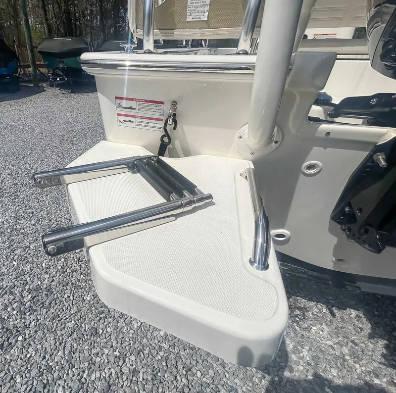 Slide: The Image of Boston Whaler 170 Montauk 2025 swim platform with stainless steel ladder. - 15