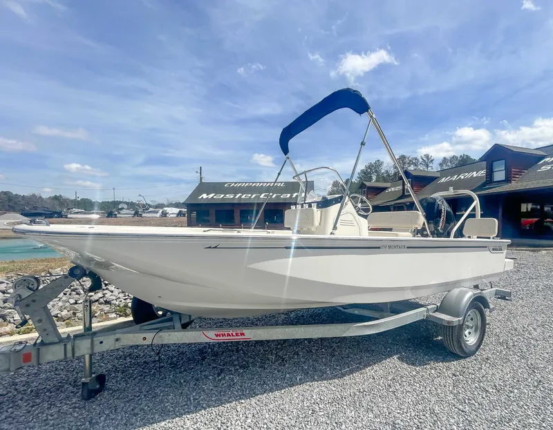 Slide: The Image of 2025 Boston Whaler 170 Montauk on trailer, sunny day. - 3