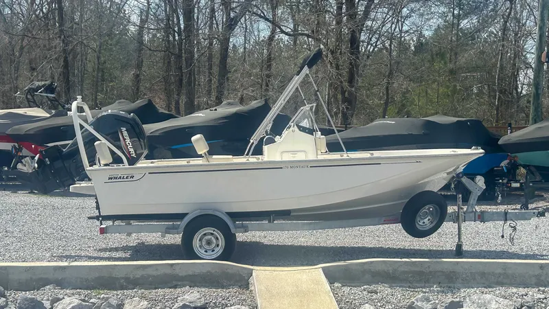 Slide: The Image of 2025 Boston Whaler 170 Montauk on trailer outdoors. - 6