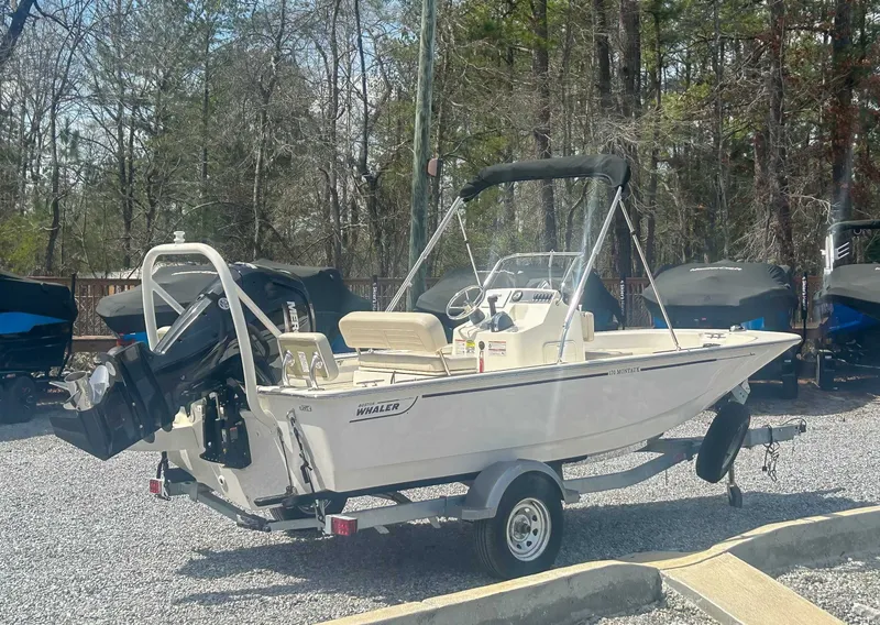 Slide: The Image of 2025 Boston Whaler 170 Montauk parked on trailer outdoors. - 7