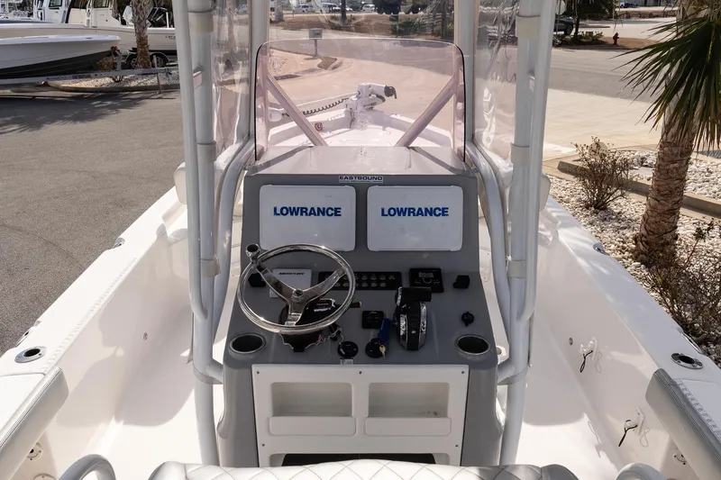 Slide: The Image of 2020 Blue Wave 2600 PureBay boat console with Lowrance electronics and steering wheel. - 12