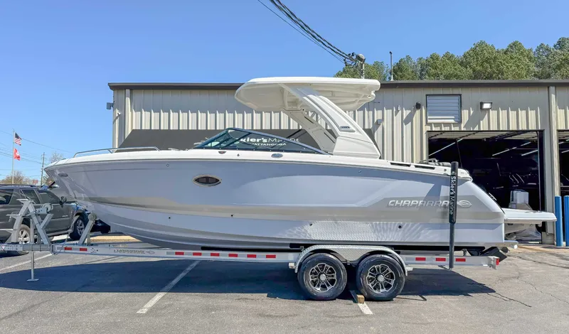 The Image of 2025 Chaparral 2870 SSX boat on trailer in front of building. - 1