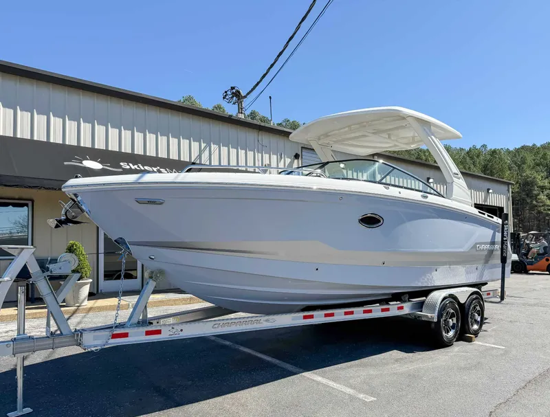 Slide: The Image of 2025 Chaparral 2870 SSX boat on trailer outside a building. - 3