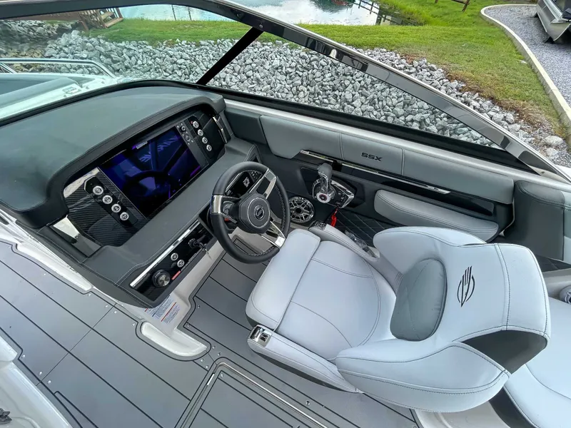 Slide: The Image of Interior of 2025 Chaparral 267 SSX with modern dashboard. - 12