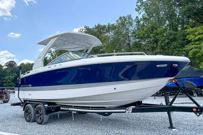 Slide: The Image of 2025 Chaparral 267 SSX boat on trailer outdoors. - 5