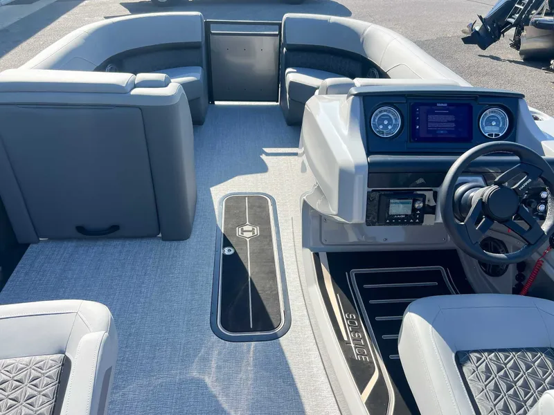 Slide: The Image of Interior of 2025 Harris Solstice 230 SLDH with modern dashboard. - 13