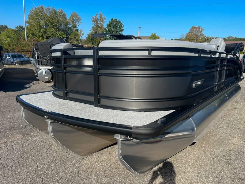 Slide: The Image of 2025 Harris Solstice 230 SLDH pontoon boat on parking lot. - 3