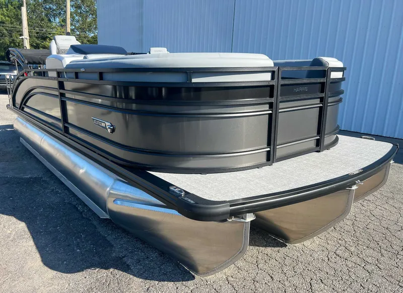 Slide: The Image of 2025 Harris Solstice 230 SLDH pontoon boat on parking lot. - 5