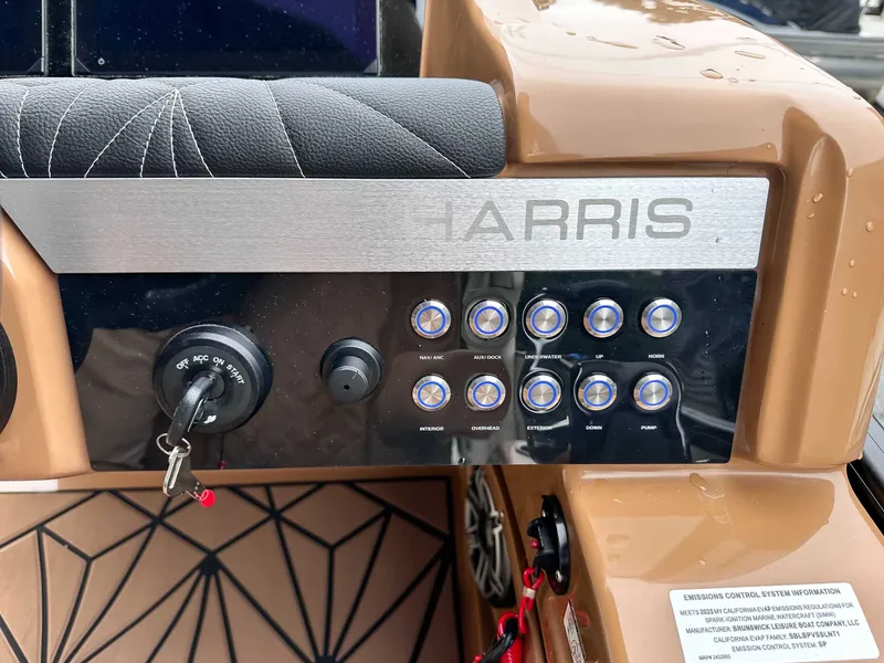 Slide: The Image of Dashboard of 2025 Harris Grand Mariner 230 SLDH with switches and ignition key. - 23