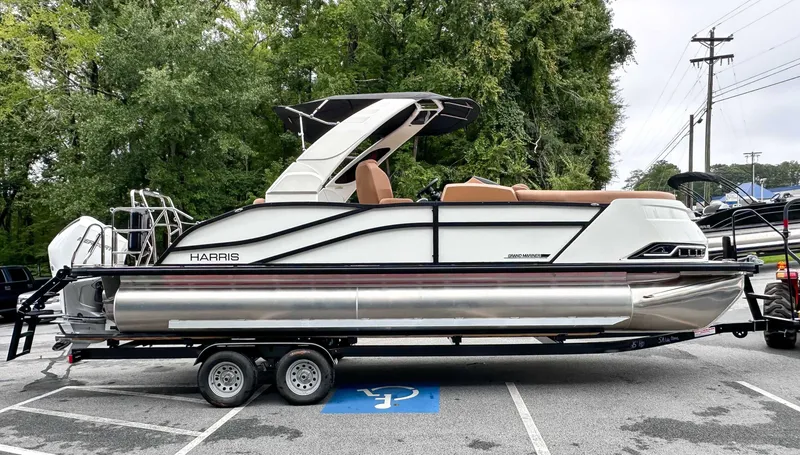Slide: The Image of Harris Grand Mariner 230 SLDH 2025 parked on trailer outdoors. - 6