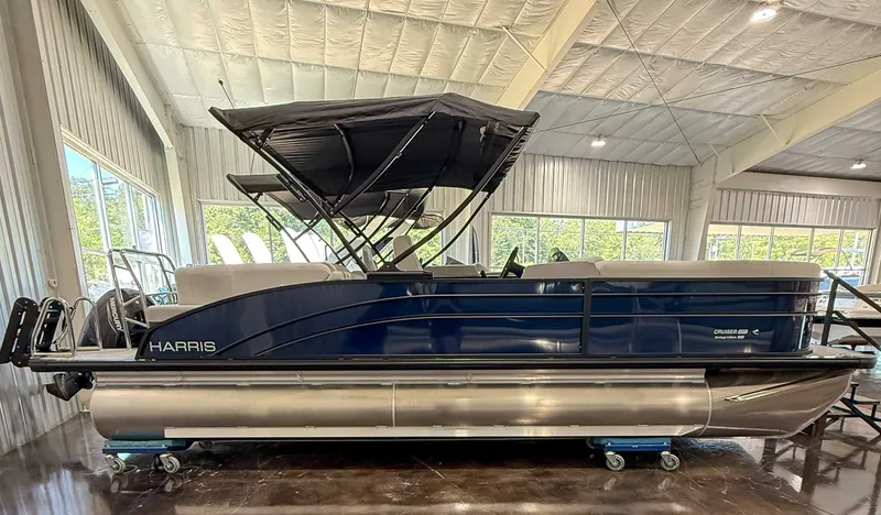 The Image of 2025 Harris Cruiser 230 CWDH pontoon boat in a showroom. - 1