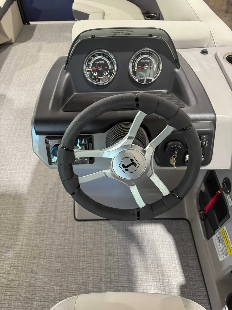 Slide: The Image of Steering wheel and dashboard of Harris Cruiser 230 CWDH 2025. - 16