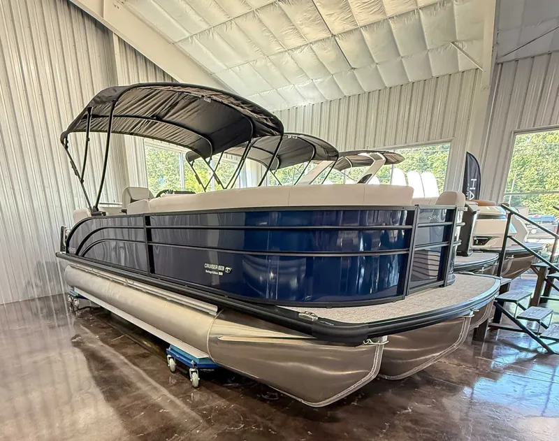 Slide: The Image of 2025 Harris Cruiser 230 CWDH pontoon boat in a showroom. - 3