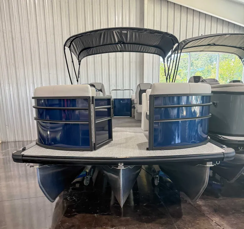 Slide: The Image of 2025 Harris Cruiser 230 CWDH pontoon boat in a showroom. - 5
