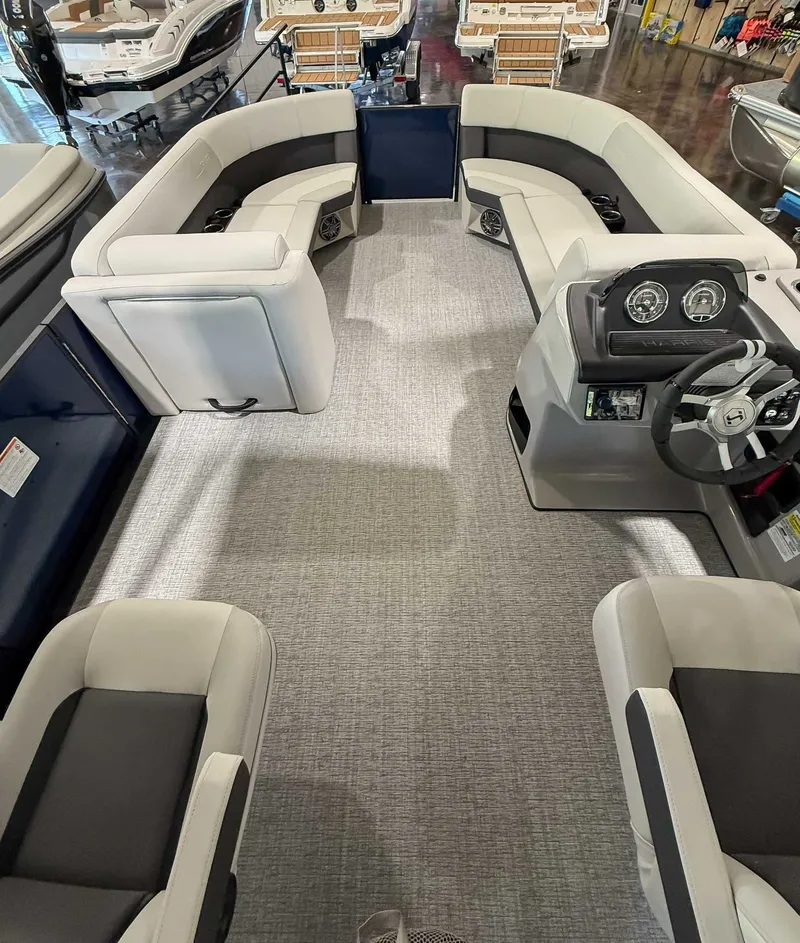 Slide: The Image of Interior of 2025 Harris Cruiser 230 CWDH with gray seating. - 9