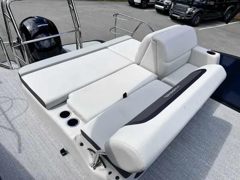 Slide: The Image of 2026 Harris Cruiser 210 SLDH with luxurious white seating area. - 21