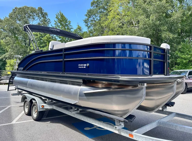 Slide: The Image of 2026 Harris Cruiser 210 SLDH pontoon boat on trailer outdoors. - 4