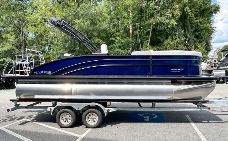 Slide: The Image of Harris Cruiser 210 SLDH 2026 parked on trailer outdoors. - 5