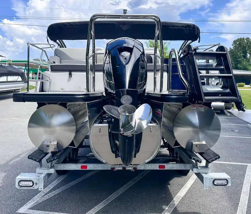 Slide: The Image of 2026 Harris Cruiser 210 SLDH with outboard motor on a trailer. - 8