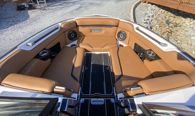 Slide: The Image of 2024 Supra SL boat interior with brown leather seating. - 14